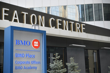 Naklejka premium road sign outside BMO Place, a corporate office, located at 33 Dundas St W, Cadillac Fairview Headquarters, Toronto