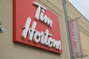 Obraz premium sign outside Tim Hortons, a coffee shop chain, located here at Gerrard Square Shopping Centre, 1000 Gerrard St E, Toronto