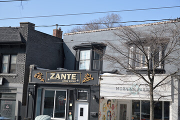 Obraz premium buildings and signs for Zante Greek Bistro and Morning Parade Coffee Bar at 1950 and 1954 Gerrard St E (near Woodbine Av), Toronto