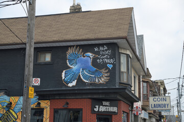 Naklejka premium exterior building facade mural and sign outside The J Arthur, a restaurant, located at 1044 Gerrard St E, Toronto