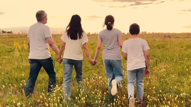child parent, mother, father nature holding hand, happy family dream, Peaceful family sunset, Fields of gold and smiles, Childhood and family ties, Family time in nature, Trust through holding hands