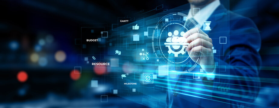 Businessman pointing at project management technology on futuristic digital interface screen, task scheduling dashboard, team collaboration system, workflow optimization concept