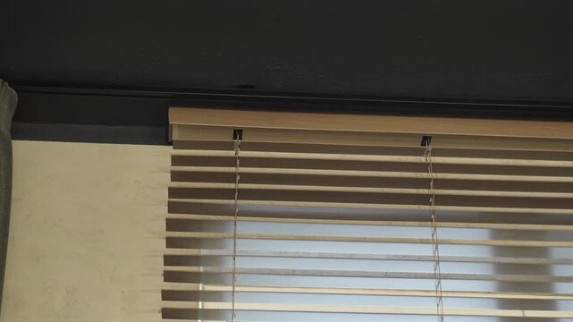 automatic opening of curtains on the remote control. large wide wooden blinds. professional window shading salon, electric drive, servo drive, elite technologies, curtains on the remote control