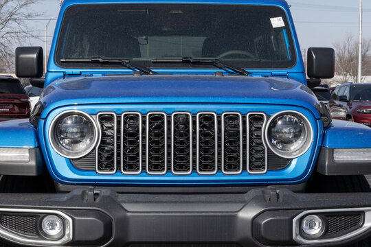 Jeep Wrangler 4-Door Sahara 4X4 display. Jeep offers the Wrangler with a 2.0L Turbocharged 4-Cylinder engine. MY:2026