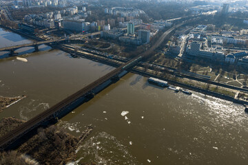 Obraz premium Aerial view of Warsaw with Vistula and Srednicowy Railway Bridge