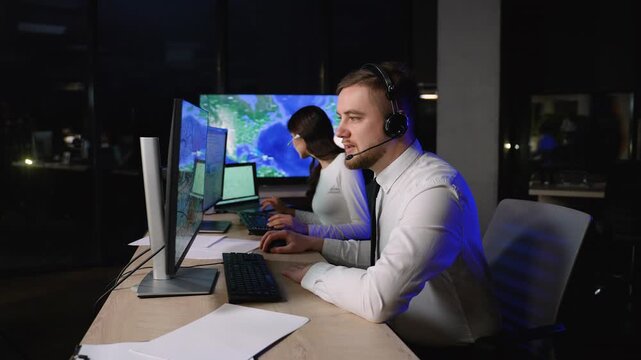 Logistics manager tracking cargo delivery on monitor