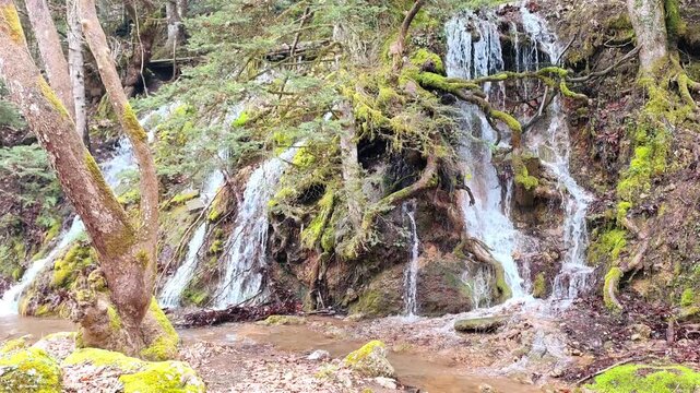 View of tranquil waterfall gently flows along the Asopos River in Pavliani Recreational Park, beside the charming village of Pavliani, set on the forested slopes of Mount Oeta.