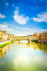 Fototapeta premium famous bridge Ponte Vecchio over river Arno at summer day, vertical shot, Florence, Italy