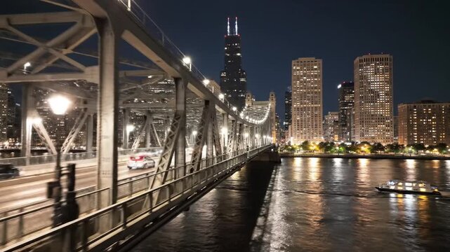 Chicago River bridge with illuminated skyline and Willis Tower