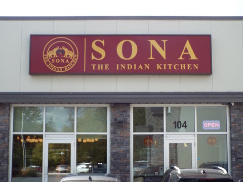 Ottawa, Ontario, Canada-July 16, 2025: The storefront for "SONA THE INDIAN KITCHEN" at 1183 Hunt Club Road at  1183 Hunt Club Rd Unit 104.