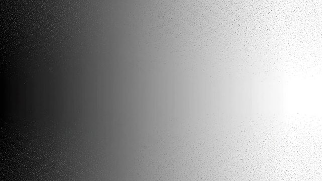 Abstract grayscale gradient with scattered specks, transitioning from dark to light