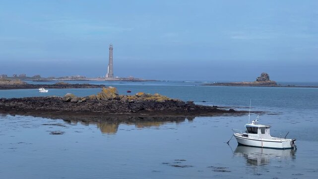 Point de Barfleur lighthouse seen from the sea, landscape aerial footage