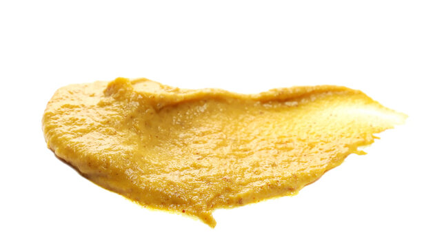 Yellow mustard sauce, spread isolated on white background, side view