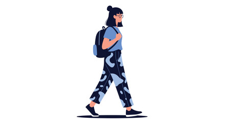 Fototapeta premium Young girl with glasses and a bun hairstyle walking while wearing a blue t-shirt, patterned trousers, and a black backpack.