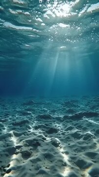 Sunlight filters through ocean water to sandy underwater sea floor with vector eps file reference