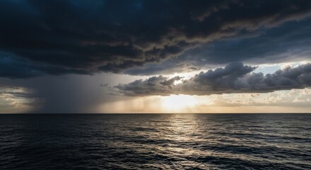 Fototapeta premium Dramatic seascape with stormy, dark clouds, rain, and a golden, sunlit horizon