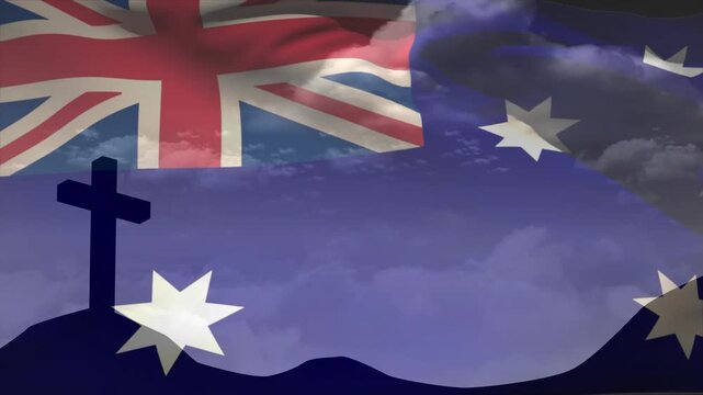 Breeze driving sheer Aussie flag rippling across sky, partly revealing hill cross, evoking memorial
