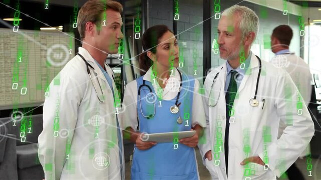 Medical team at desk doctor speaking center clinician holding tablet showing green overlay for care