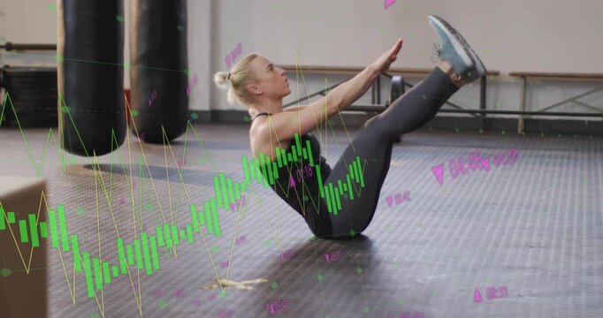 Woman engaging core, initiating V sit with green charts and pink numbers tracking fitness