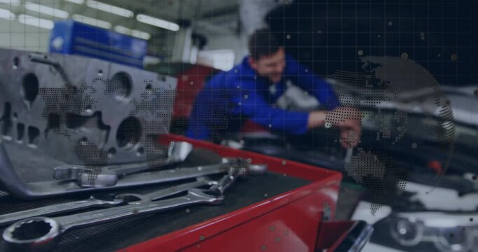 Camera refocus showing tech reaching engine, doing repair beside red cart, dotted overlay obscuring