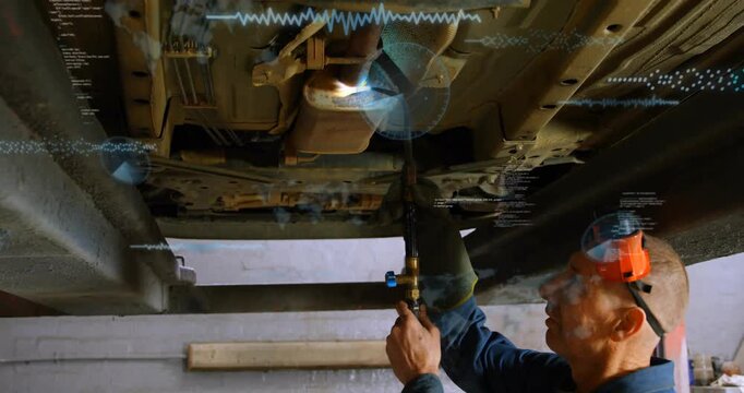 Auto tech raising oxy torch under car igniting heating exhaust seam causing HUD tracking for repair