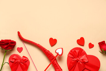 Naklejka premium Composition cupid's bow, gift boxes and rose flowers on color background. Valentine's Day celebration