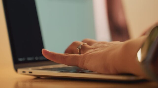 Person drafts content in comfortable setting. Individual types and edits post in cozy hotel environment. Creative professional drafts and refines social media captions in warm hotel ambiance