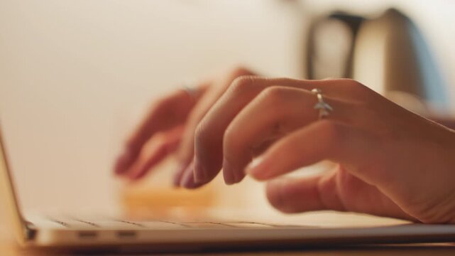 Traveler quickly writes checkout details. Individual rapidly documents checkout while packing efficiently. Someone hurriedly types message on laptop as they pack and prepare to leave hotel