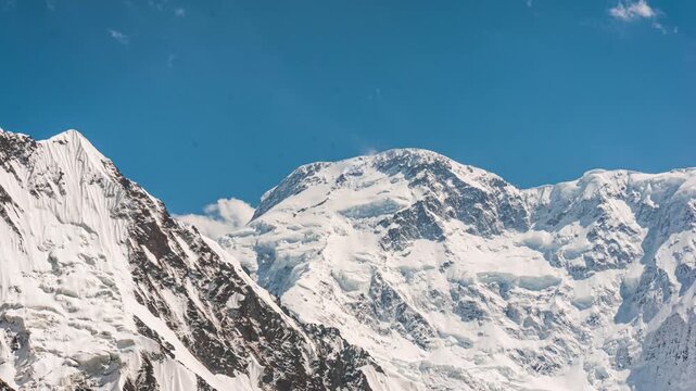 Pobeda Peak in sunny weather. Timelapse in the mountains of Kyrgyzstan. Beautiful Tien Shan. 4K
