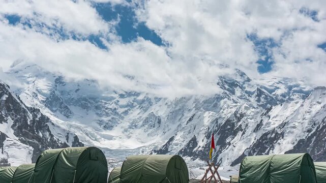 Base camp with Pobeda Peak hidden by clouds in the background. Beautiful views of the Tien Shan, Kyrgyzstan. 4K Timelapse