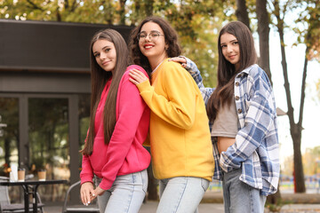 Happy teenage girls in park