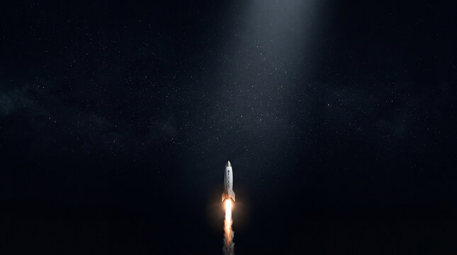 A powerful rocket launches upwards into a dark, star-filled night sky