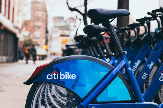 Citi Bike bicycles lined up at docking station on city street in New York City