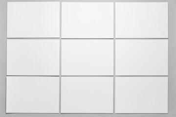 Many blank brochures on grey background
