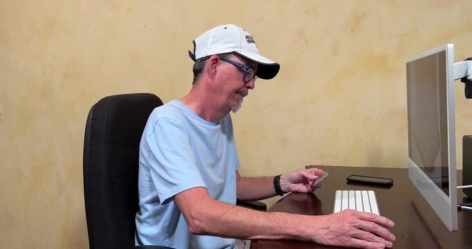 Shopping Online Man Cuts up Credit Card MS