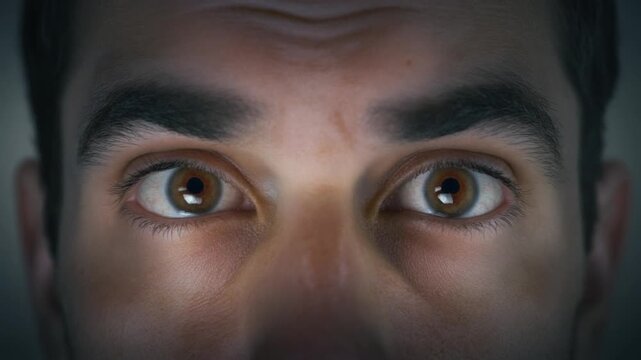 Close-up of a man's intense eyes on the road to damascus with a dramatic, dark background