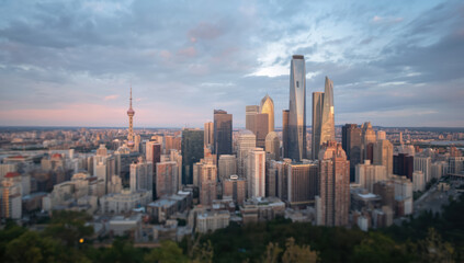 Fototapeta premium Urban skyline cityscape modern skyscraper tower sunset reflective glass highrise downtown