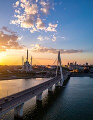 Aerial view of a city bridge at sunset