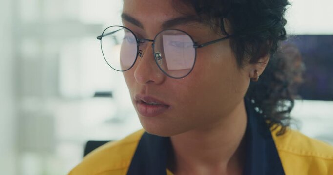 Close-up young Black female robotics engineer coding AI software for robotic arm in laboratory. Embedded system, firmware testing, machine learning, industrial automation, future technology concept.