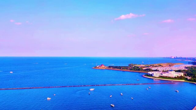 A smooth drone flight over Lake Michigan revealing the iconic Adler Planetarium along the shoreline, with the Chicago skyline rising dramatically in the background for a stunning cinematic view.