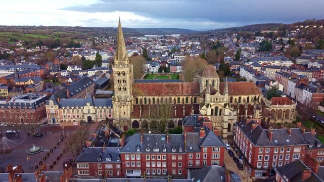 Approaching drone fly to the Romanesque styled Lisieux Cathedral aka Cathedrale Saint-Pierre de Lisieux, France
