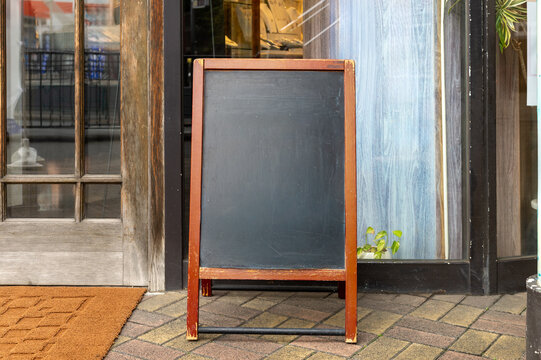 Large blank billboard on a street wall, banners with room to add your own text