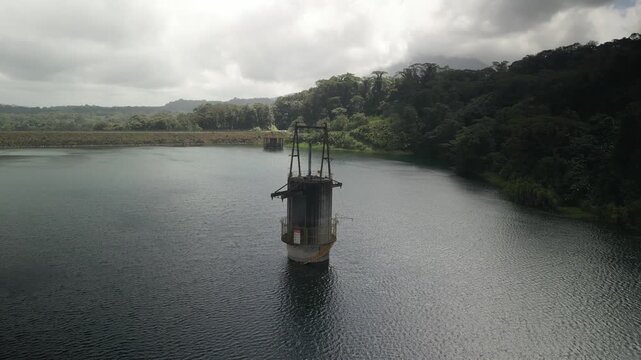Aerial circling bouy in Lake Arenal in Costa Rica with jungle hills in background