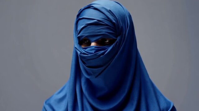 A woman wearing a blue niqab