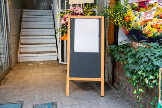 Large blank billboard on a street wall, banners with room to add your own text