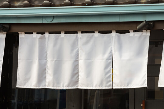The curtain-like fabric that hangs in front of traditional Japanese restaurants and shops not only serves as a signboard, but holds a larger meaning,