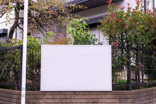 Large blank billboard on a street wall, banners with room to add your own text