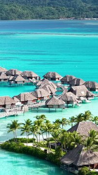 Bora Bora, French Polynesia. Vertical Drone Shot of Luxury Villas of Tropical Resort