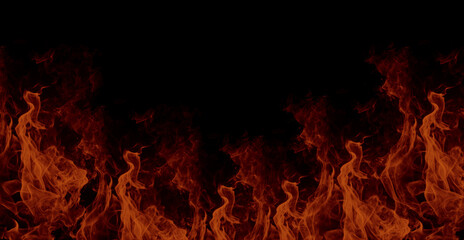 Powerful flames of fire against black background with vibrant orange red glow and dynamic burning motion creating striking dramatic heat atmosphere