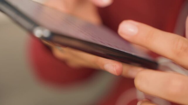 Hands control playlist. Individual adjusts audio settings on mobile device. Close perspective showing hands manipulating music selection and podcast queue on phone in relaxed atmosphere